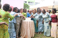 Some members of the  GBC Ladies Association cuting a cake