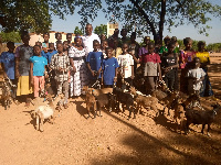 Raymond Ayinne among the beneficiary children and their parents