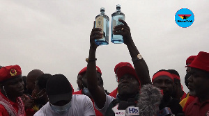 Captain Smart pouring libation at the demonstration