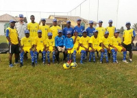 Players of Unistar in a pose with a rep of Maccabi Tel Aviv