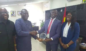 Dr. Yaw Osei Adutwum being presented with the award