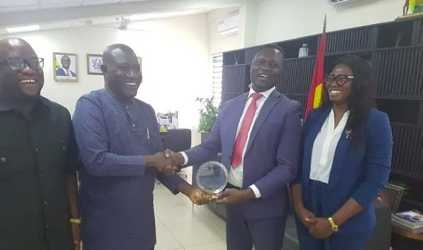 Dr. Yaw Osei Adutwum being presented with the award