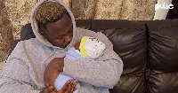 Ghanaian hiplife and hip-hop musician Medikal with daughter