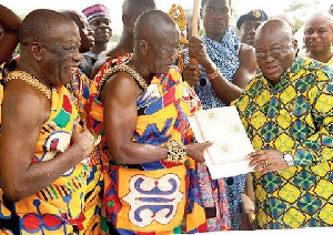 President Akufo-Addo presenting the Constitutional Instrument to Nana Mprah Besewmuna III