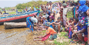 Relatives  mourning on the shores of Lake Victoria at Mchigondo Village in Bunda district