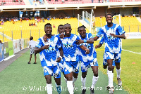 Great Olympics players celebrating a goal