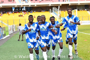 Great Olympics players celebrating a goal