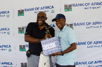 Managing Director of Bank of Africa, Kobby Andah presenting the prize to the Men's Category A winner