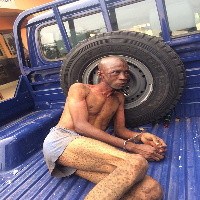 The suspect at the back of a Police pickup