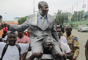 Frederick Lartey Otu is carried by admirers after yesterday