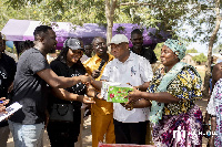 Joe Mettle presents the items to MP for North Tongu, Okudzeto Ablakwa