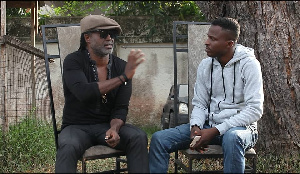 Reggie Rockstone [L] granting Attractive interview