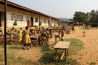 Students of Akote M/A JHS were seen learning in the corridor of  newly constructed classroom block