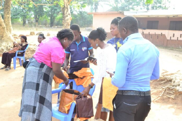 Irene Adjei making the presentation to the school