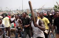 The mob, armed with weapons, raided their residence