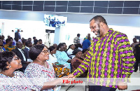 Dr. Matthew Opoku Prempeh in a handshake with GNAT executives.