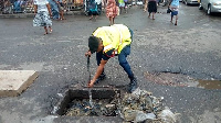 Lance Corporal Simon Agbeko desilts choked drains in Accra