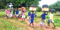 Students carrying chop boxes