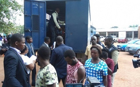 Fourteen suspects have been arraigned for allegedly murdering him