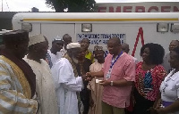 Dr Gilbert Buckle receiving the ignition key of the vehicle from Sheikh Osman Nuhu Sharubutu