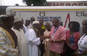 Dr Gilbert Buckle receiving the ignition key of the vehicle from Sheikh Osman Nuhu Sharubutu