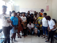 Some of the team with the children in a group photo