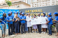 Officials of Awake Purified Drinking Water presenting a cheque of GHC 75,000