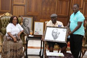 President Kufuor presented his portrait and other souvenirs embossed with the NGO’s emblem