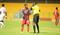 Asante Kotoko deputy captain Emmanuel Gyamfi speaking to a referee