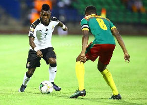 Christian Atsu in action against Cameroon