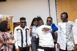 Kelvyn Boy hugging Shatta Wale