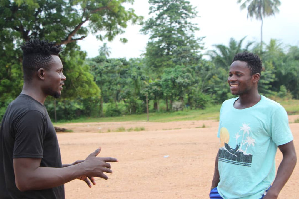 Issah Yakubu with one of the coaches during the competition