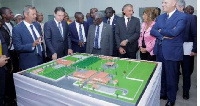 Eni officials and Senior Minister, Yaw Osafo-Marfo (M) in a group photograph