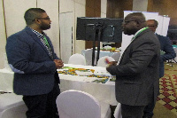 An Israeli exhibitor explaining issues to some Ghanaians