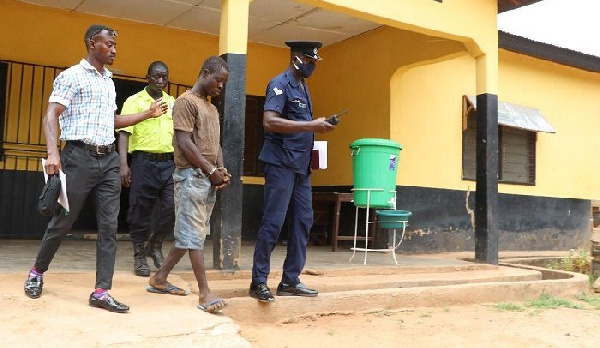 Danaah Sulemana being escorted by police