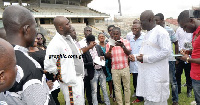 Isaac Asiamah discussing with one of the stadium managers during one of  his tour