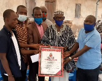 Teacher Kelly received a citation from old students of Busunu L/A primary school