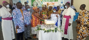 Religious and Traditional leaders and hospital management cutting a cake to mark the event