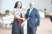 Gloria Akuffo (left) and Githu Muigai (right) shaking hands