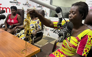 Woman Displays Torn Beads 