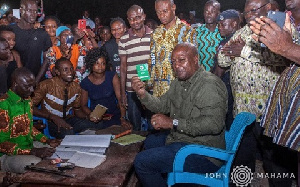 Former President John Mahama with his NDC membership card