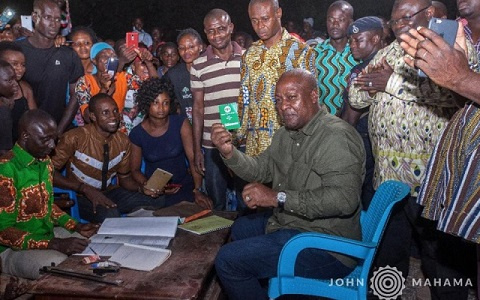 Former President John Mahama with his NDC membership card