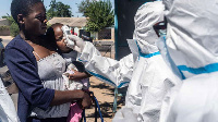 Medical personnel check temperatures of patients visiting Mpilo Hospital in Bulawayo, (AFP)