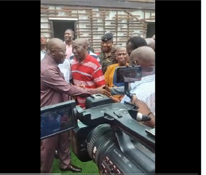 Otumfuo Osei Tutu II (left) in a handshake with one of the club legends