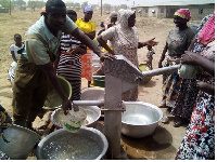 Community members struggling for water from a borehole in Chereponi, Northern Ghana