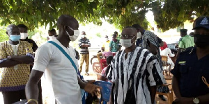 Adam Salifu Braimah interacting with some registration officers