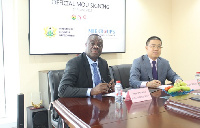 Business Development Minister in a handshake with the Chairman of MIE Groups David Wang