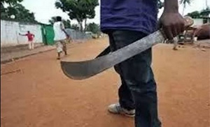 File photo of a man holding cutlasses