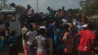 Farmers rushing for the cutlasses in the KIA truck