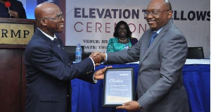 Alexander Williams (R) receiving his citation from John Mbroh, Chairman of the Fellows Status C'ttee